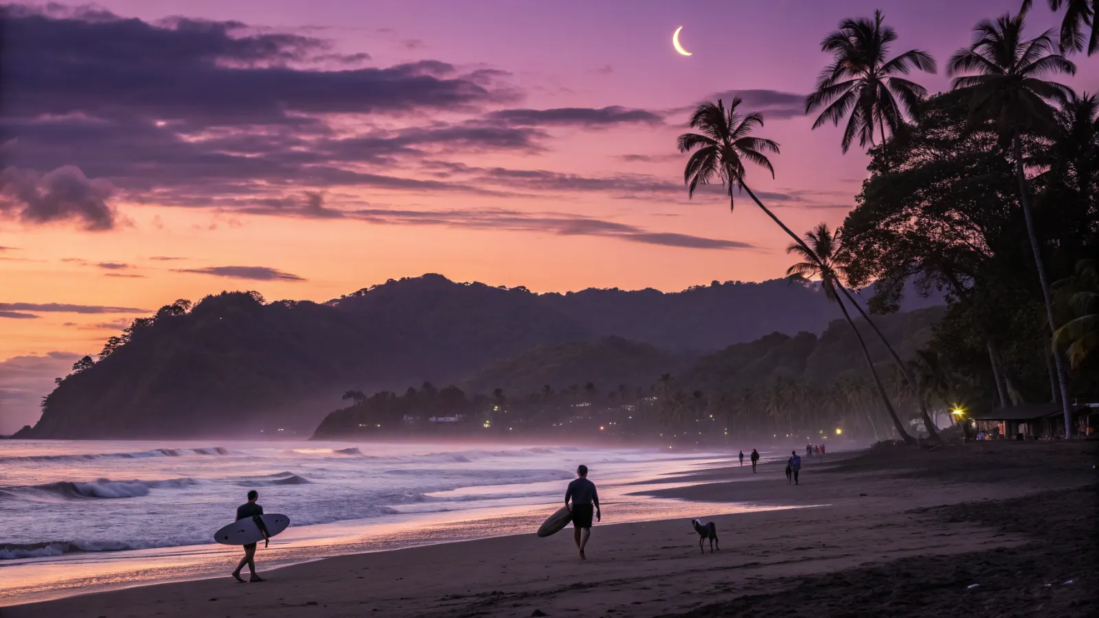 Jacó beach at sunset in December with surfers, palms and green hills behind